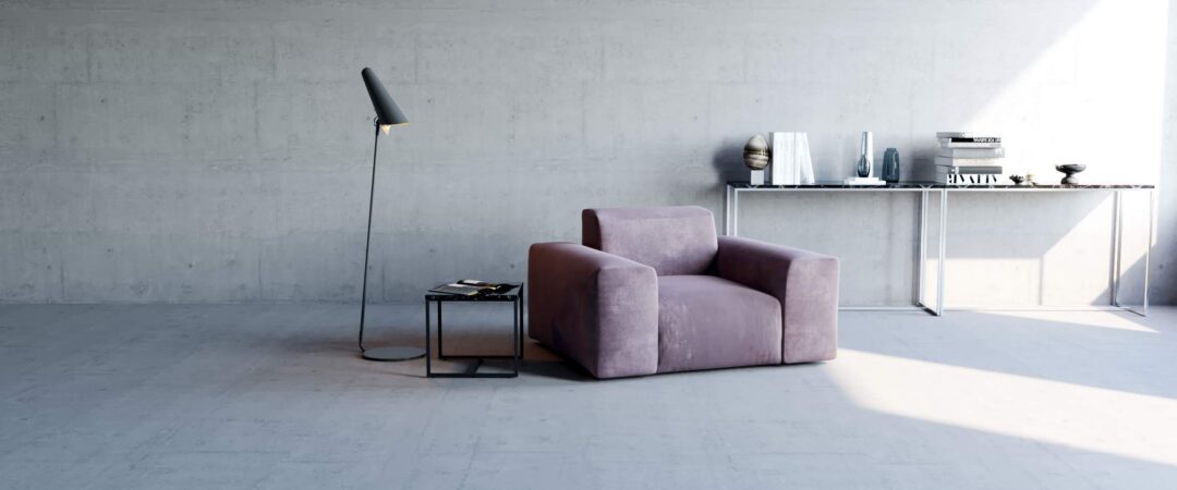 Un espace salon à la décoration minimaliste avec un fauteuil gris et un lampadaire en métal.