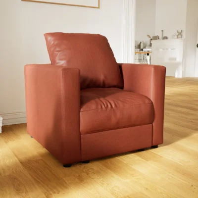Fauteuil FLAYR en simili, couleur cognac.